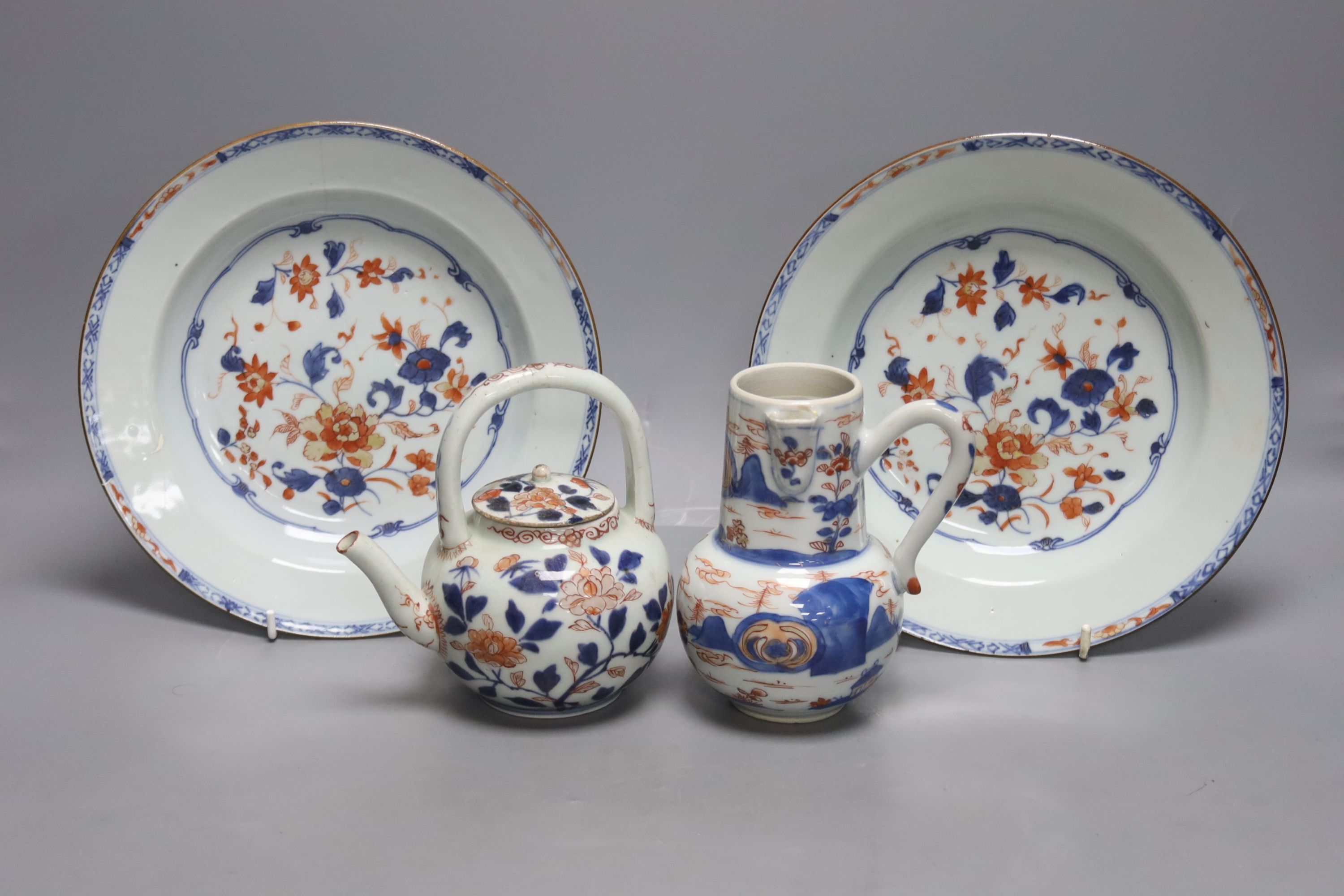 A pair of 18th century Chinese Imari style dishes, diameter 22.5cm, together with a similar chocolate pot and an 18th century Japanese Arita teapot, associated cover